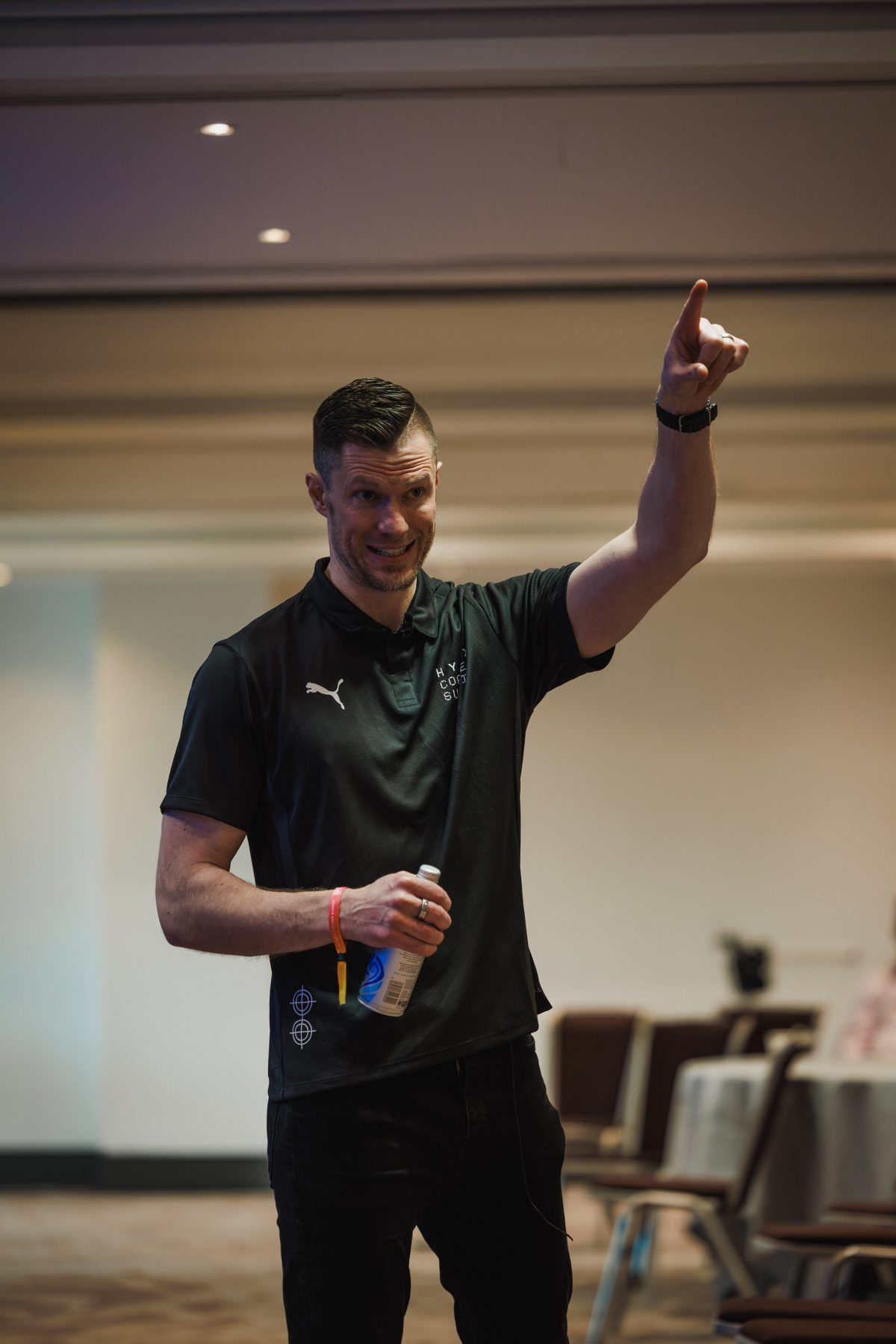 Sean Light speaking to a room of athletes and clinicians